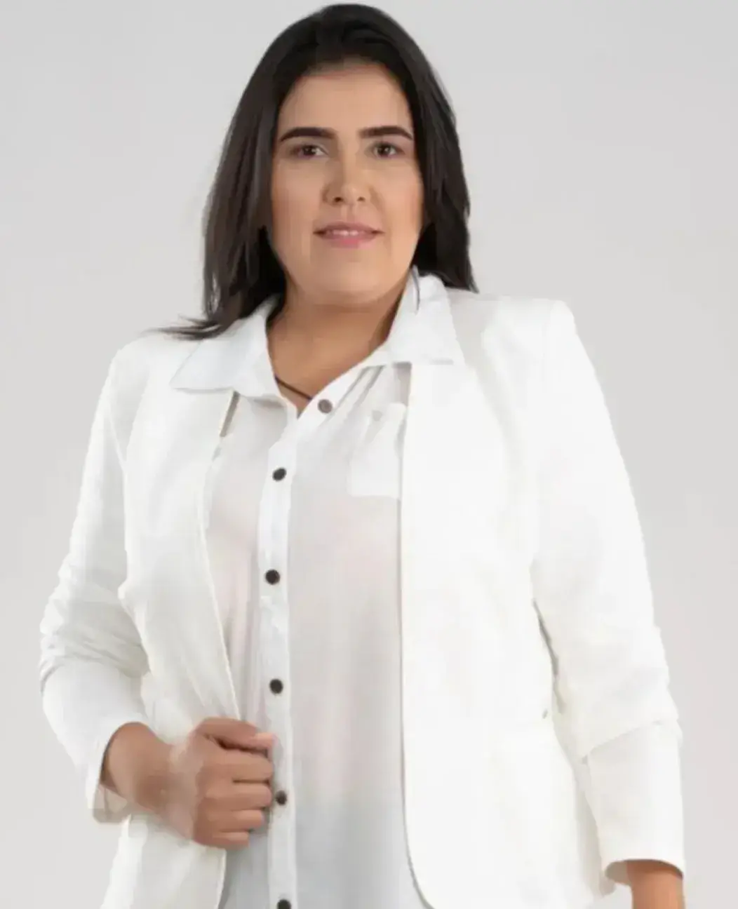 Aline Xavier, founder of Agnus Dei Cleaning Services, wearing a white suit and smiling confidently, representing leadership and excellence in the Best Cleaning Services in Connecticut.