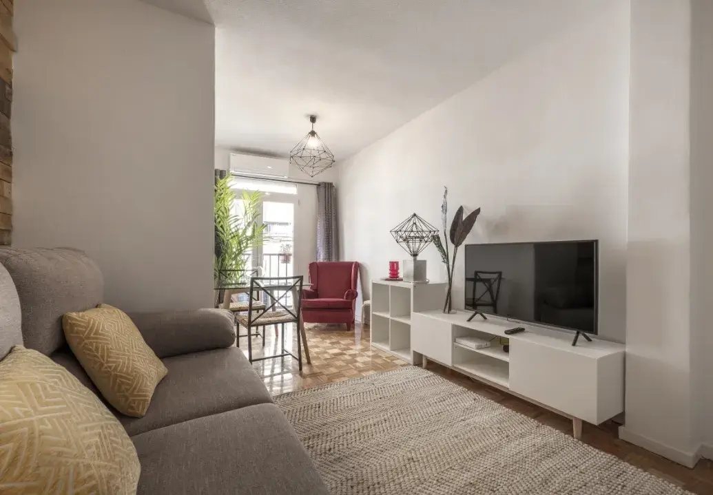 Deep cleaned living room with polished floors, dust-free surfaces, and sparkling windows