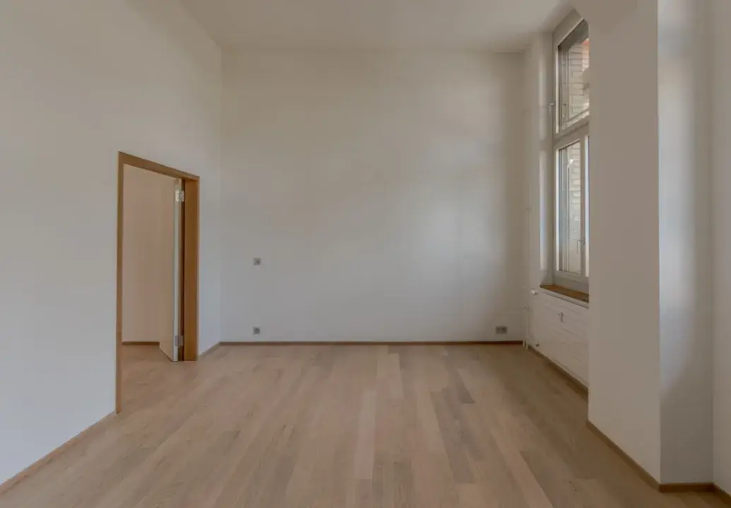 Empty apartment with spotless floors and walls after move-in/out cleaning service
